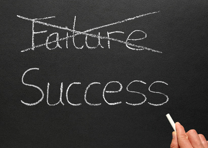 Crossing out failure and writing success.
